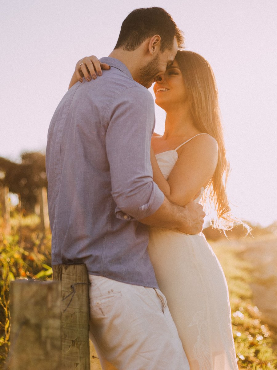 Couple embracing outdoors at sunset