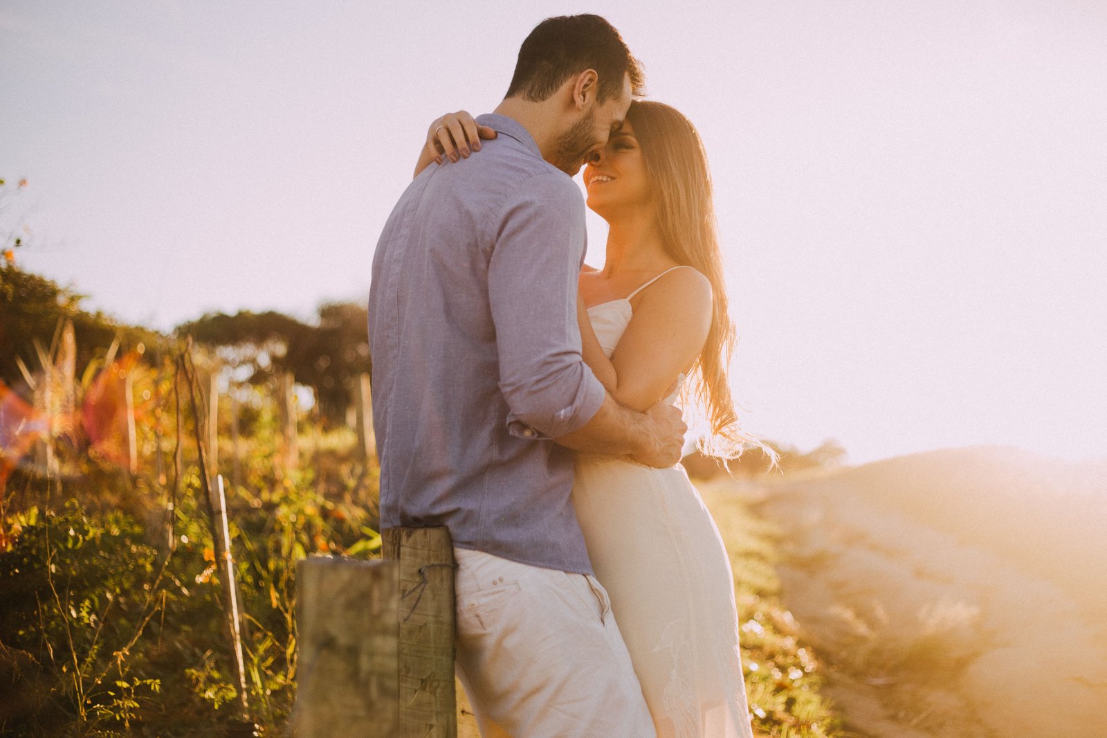 Couple embracing outdoors at sunset